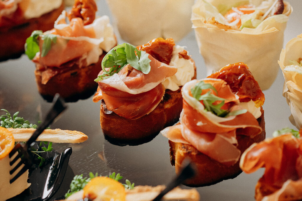 Assortment of snacks on open buffet festive table in restaurant. Catering plate